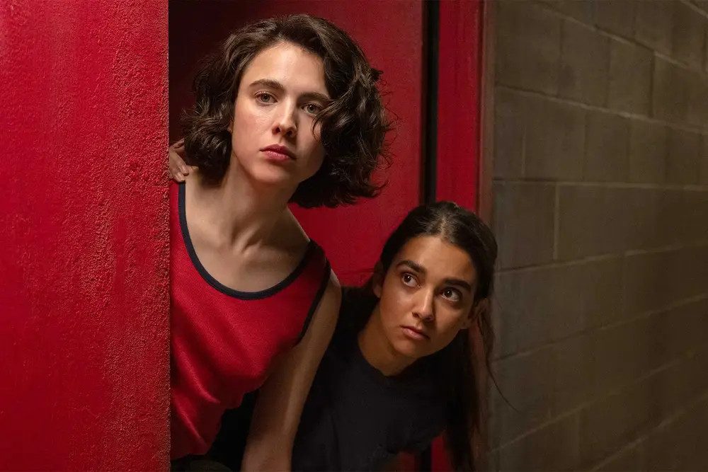Margaret Qualley and Geraldine Viswanathan in 'Drive-Away Dolls'. Margaret Qualley and Geraldine Viswanathan in 'Drive-Away Dolls'.