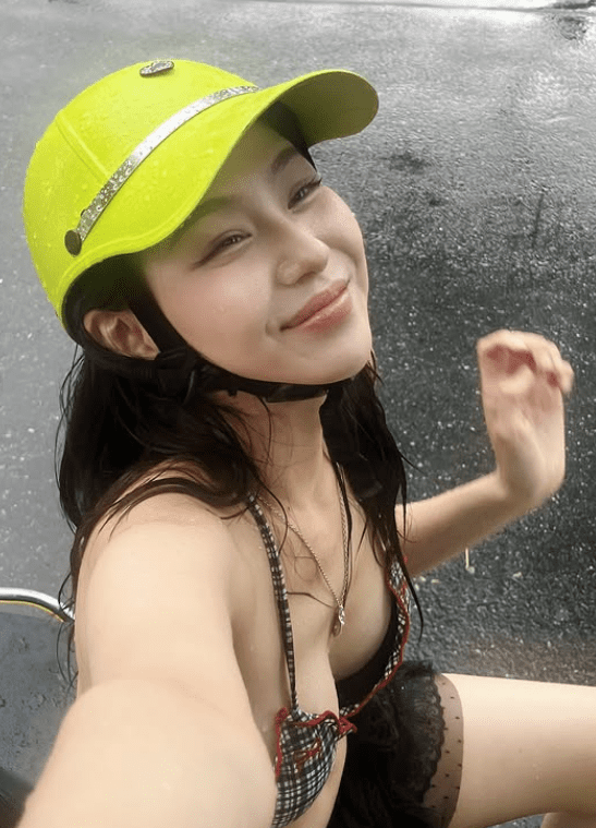 The buzz around images of a pretty girl in a bikini, innocently checking in on the street: Attractive outfit but inappropriate 2 Beautiful girl in bikini enjoying her time during the rain.