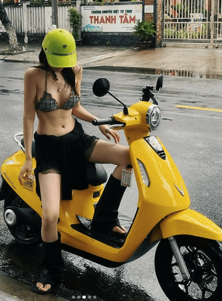 The buzz around images of a pretty girl in a bikini, innocently checking in on the street: Attractive outfit but inappropriate 5 Beautiful girl in bikini enjoying her time during the rain.