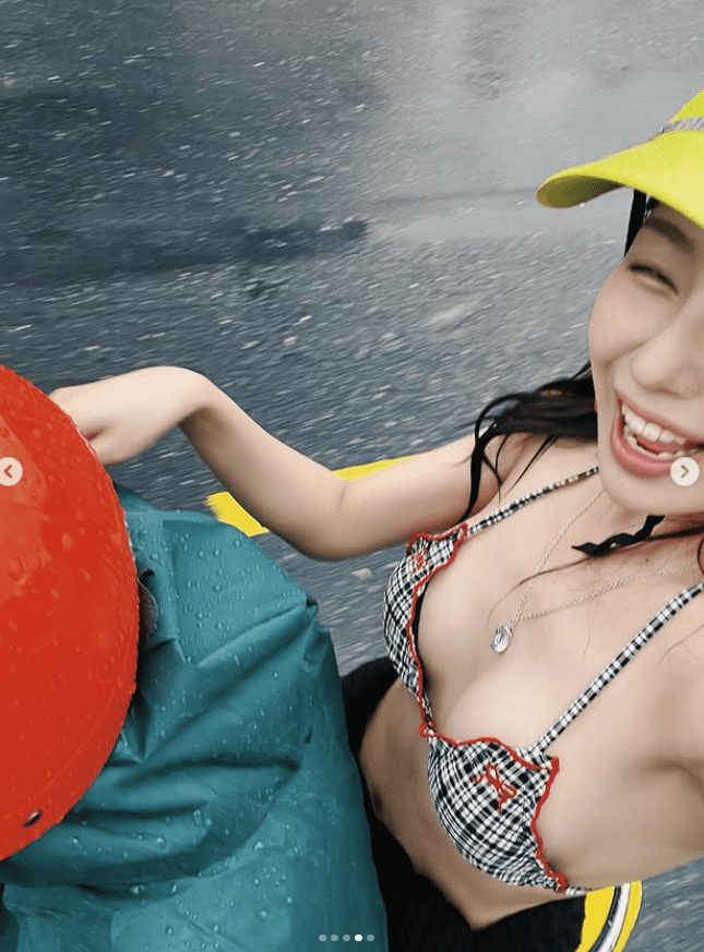 The buzz around images of a pretty girl in a bikini, innocently checking in on the street: Attractive outfit but inappropriate 1 Beautiful girl in bikini enjoying her time during the rain.